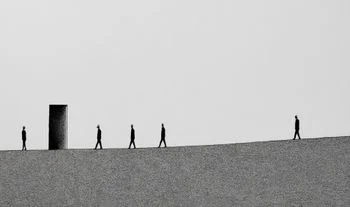 bankers walking near a door 